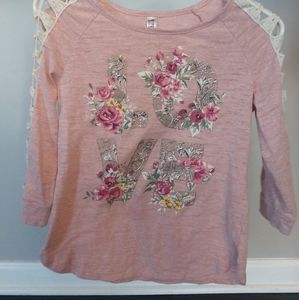 Light pink "LOVE" shirt with flower accents